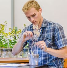 College student working with Fast Plants